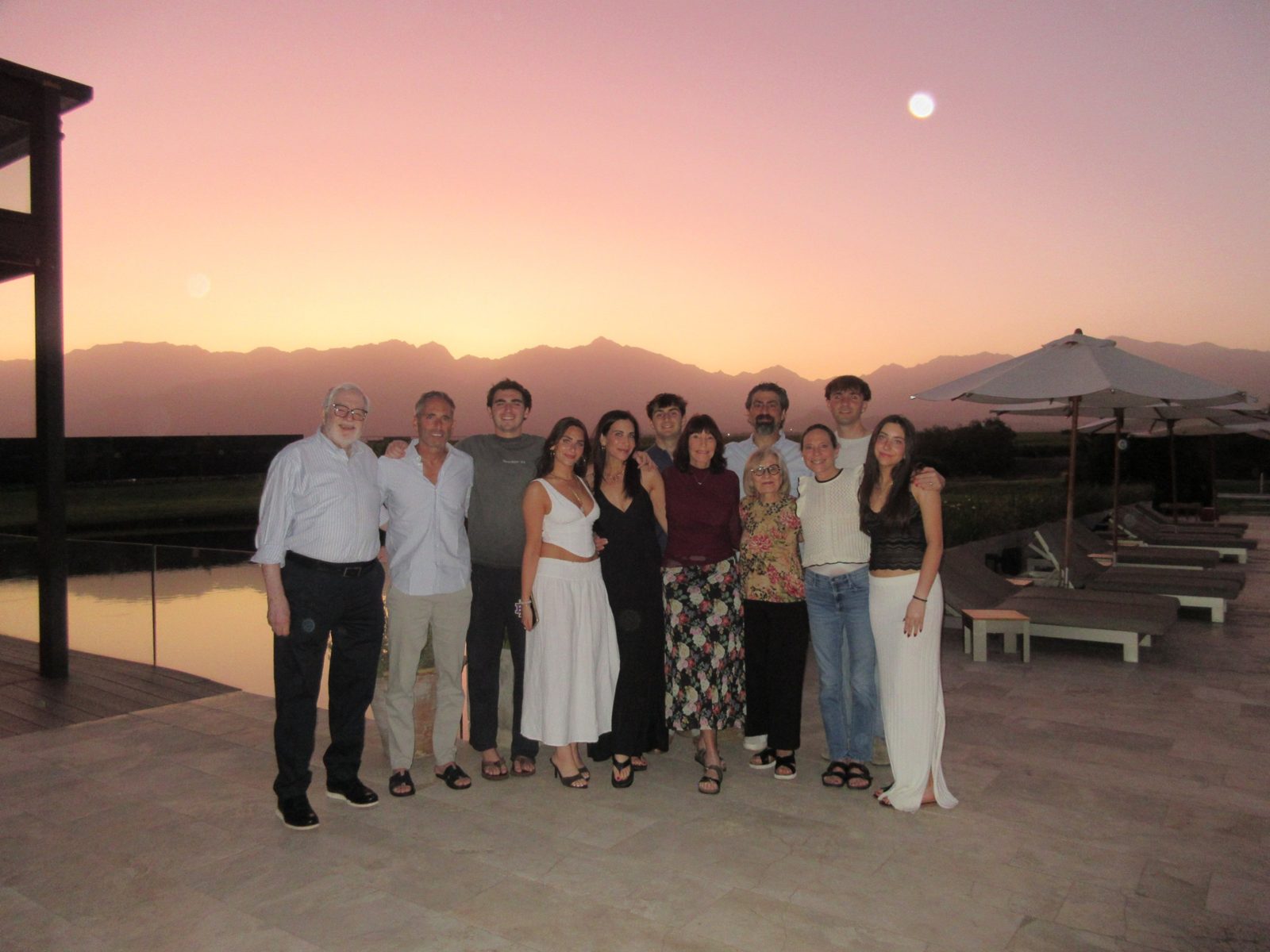 Claudio with his family at sunset, the Andes behind them in Mendoza