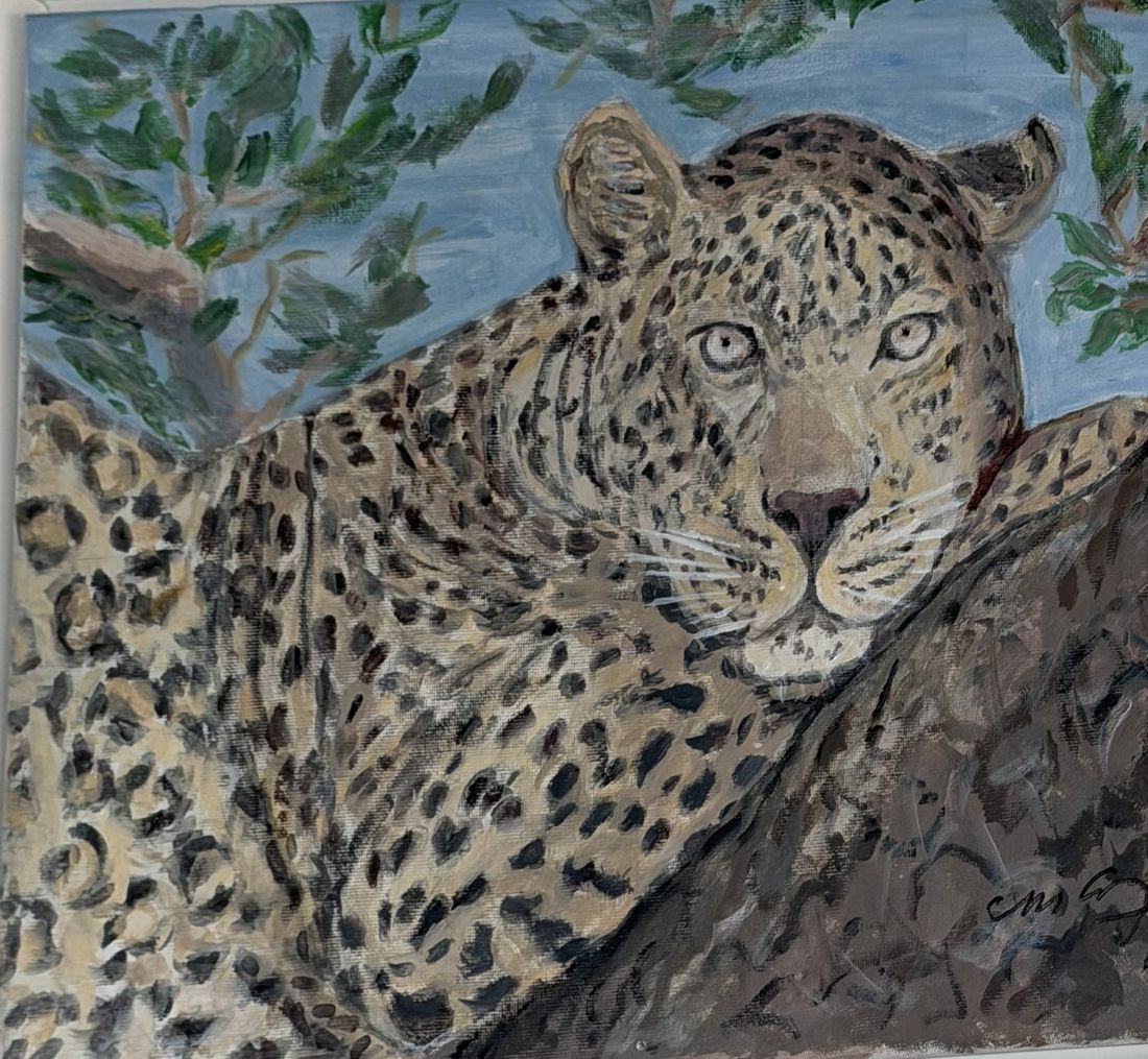 Painting of a leopard lying on a tree branch